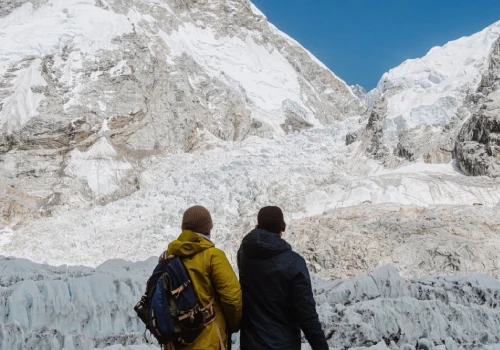 a guide explains about himalayas to his client in ebc
