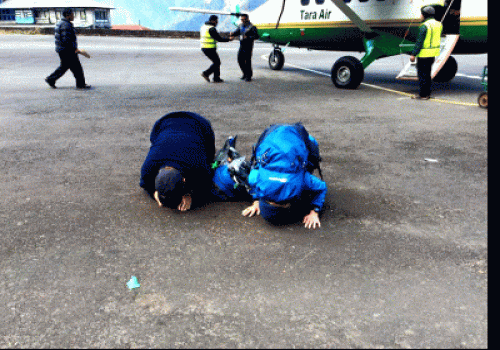 Trekkers Bowing There head before beginning their trip in Tenzing Hillary Airport Lukla