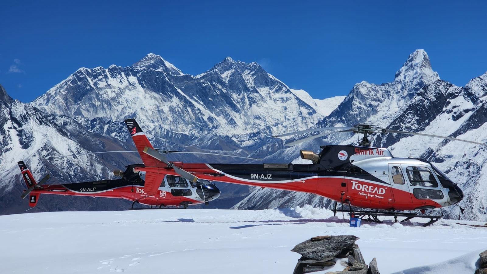 helicopters landing at helipad in everest region