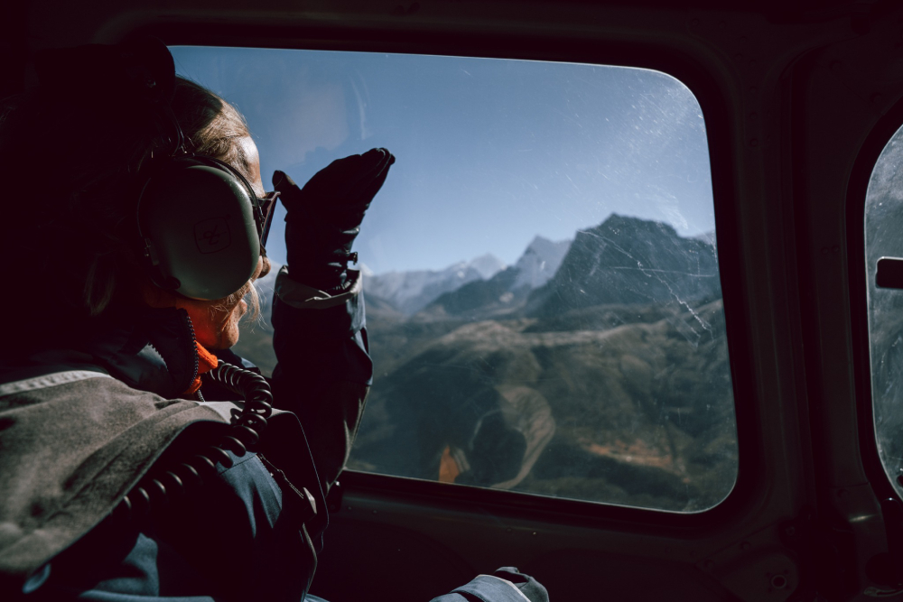 view from inside helicopter in himalayas