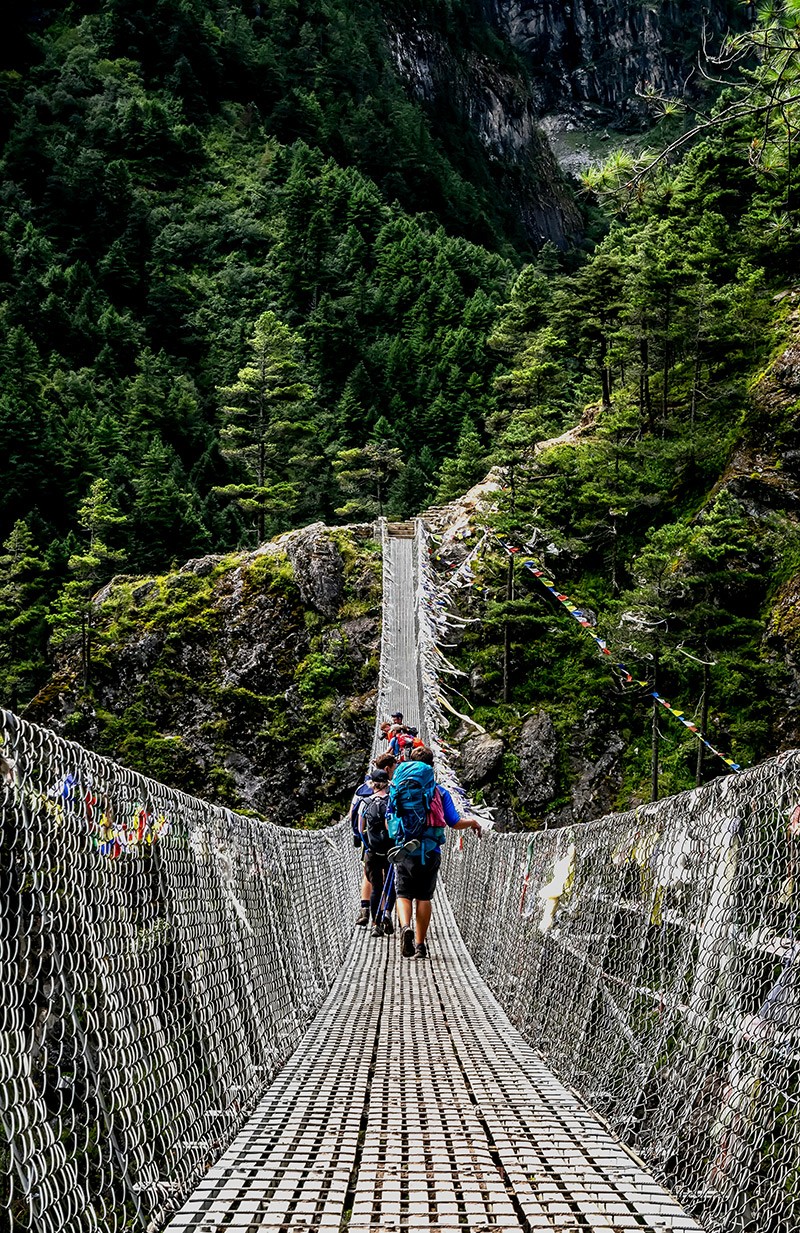 People Crossing the suspension during EBC Trek