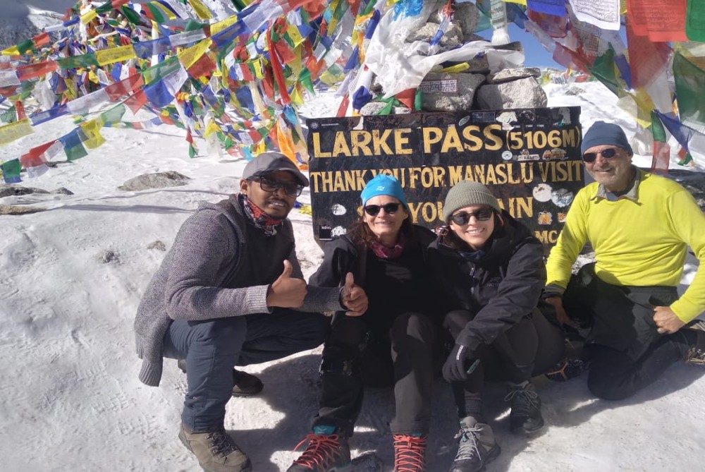 trekkers pose at larke pass