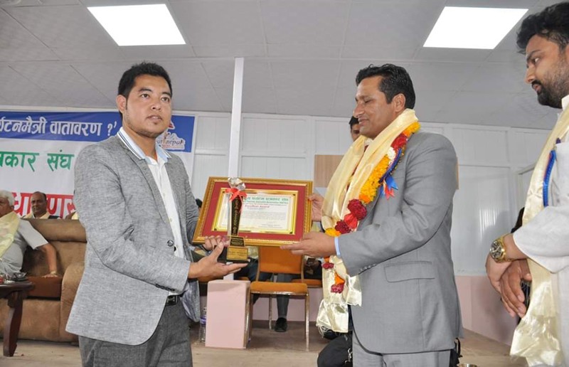 Receiving Award By Ramkrishna Timalsina
