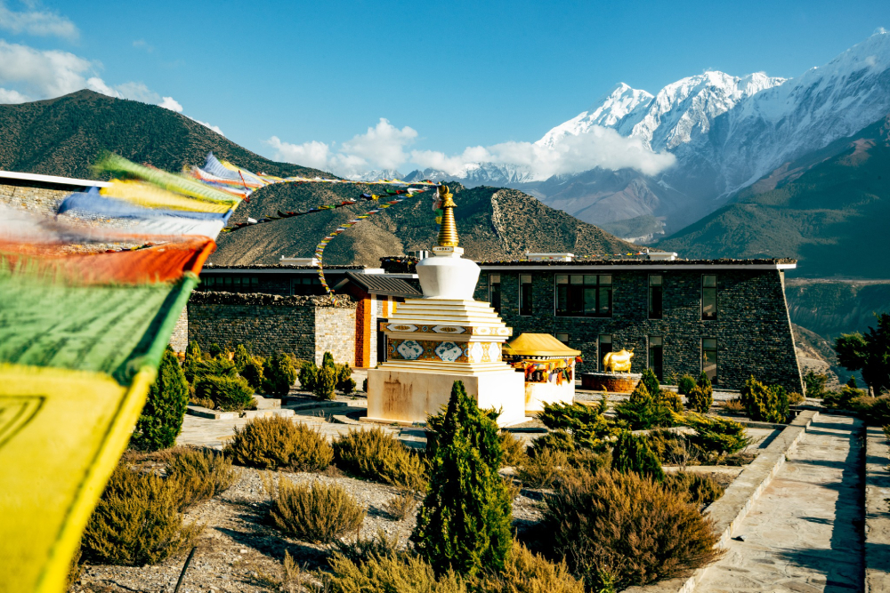 chorten with fluttering prayer flags