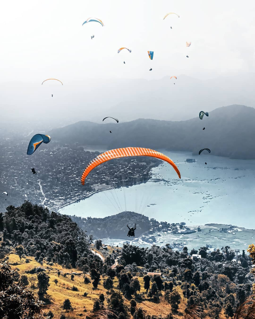 paragliding over lake fewa in pokhara