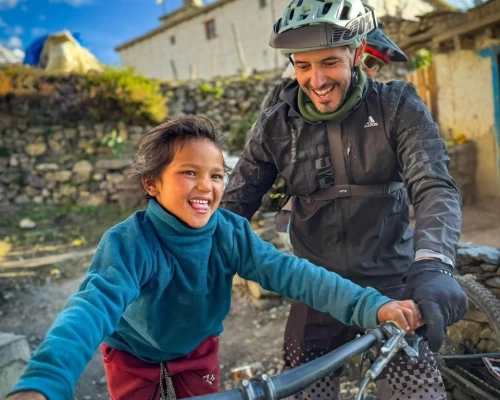 A Biker Plays With A Child In Mustang