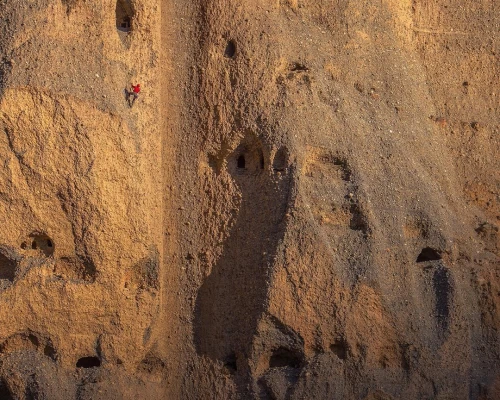 A Researcher Climbs The Sky Caves In Mustang With The Help Of Rope