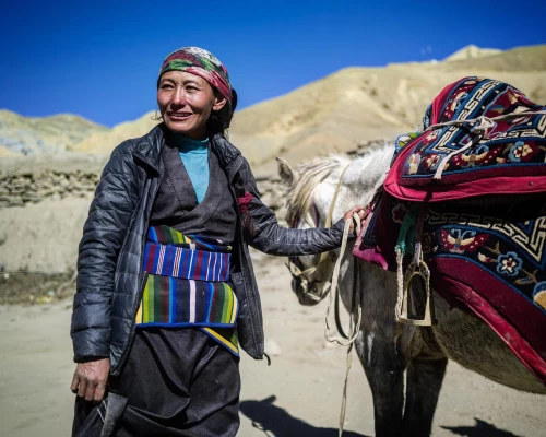 A Woman Ready To Ride Her Horse In Lo Manthang