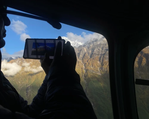 Passenger Enjoying Mountain Views During Annapurna Helicopter Tour